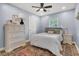 Comfortable bedroom with a queen bed, dresser, and ceiling fan at 402 Woodward Blvd, Summerville, SC 29483