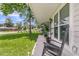 Inviting front porch with rocking chairs and lush landscaping, creating a cozy and welcoming entrance at 402 Woodward Blvd, Summerville, SC 29483