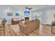 Cozy living room featuring a fireplace, plush sofas, and a bright window at 402 Woodward Blvd, Summerville, SC 29483
