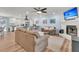 Bright living space featuring an open floorplan with fireplace, sofas, and views of the kitchen at 402 Woodward Blvd, Summerville, SC 29483