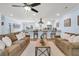 Open-concept living room with modern furnishings, breakfast bar, and access to the kitchen area at 402 Woodward Blvd, Summerville, SC 29483