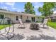 A backyard patio with seating, a grill, and a fire pit, perfect for outdoor entertaining and relaxation by the house at 402 Woodward Blvd, Summerville, SC 29483