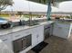 Outdoor wet bar features stainless steel appliances and granite countertops at 4352 Bream Rd Rd, North Charleston, SC 29418