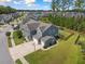 Aerial view of home and neighborhood showcasing lush landscaping and well-maintained surroundings at 443 Coopers Hawk Dr, Summerville, SC 29483