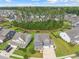 Stunning aerial view of a neighborhood with well-maintained lawns and mature trees at 443 Coopers Hawk Dr, Summerville, SC 29483