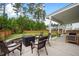 Enjoy this beautiful backyard patio with a gas fire pit, perfect for relaxing and entertaining outdoors at 443 Coopers Hawk Dr, Summerville, SC 29483