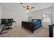 Neutrally decorated bedroom showcasing a sleek desk setup, a window view, and plush carpet at 443 Coopers Hawk Dr, Summerville, SC 29483