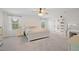 Spacious bedroom featuring a large bed, ample natural light, and a vanity area, creating a relaxing and functional space at 443 Coopers Hawk Dr, Summerville, SC 29483