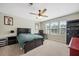 Comfortable bedroom with a ceiling fan, large bed, natural light, and a serene atmosphere at 443 Coopers Hawk Dr, Summerville, SC 29483