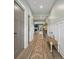 Welcoming hallway featuring wainscotting, hardwood floors and stylish furnishings at 443 Coopers Hawk Dr, Summerville, SC 29483