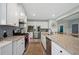 Well-equipped kitchen with island, granite counters, and stainless-steel appliances at 443 Coopers Hawk Dr, Summerville, SC 29483