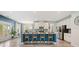 Stylish kitchen features white cabinets, stainless steel appliances, and a large island with seating at 443 Coopers Hawk Dr, Summerville, SC 29483