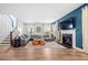 Inviting living room featuring a cozy fireplace, plush sectional sofa, and stylish decor, creating a warm and welcoming atmosphere at 443 Coopers Hawk Dr, Summerville, SC 29483