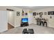 Basement entertaining area with a built in bar area, television and comfortable carpeting at 4630 Palm View Cir, North Charleston, SC 29418