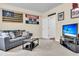 Finished basement featuring a comfortable seating area with a sofa and a flat-screen television at 4630 Palm View Cir, North Charleston, SC 29418