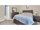 Comfortable bedroom featuring a gray wood bed frame and a matching dresser set next to an open doorway at 4630 Palm View Cir, North Charleston, SC 29418