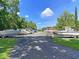 Wide view of Boat and RV parking area with ample space and lush greenery at 4630 Palm View Cir, North Charleston, SC 29418