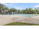 A spacious outdoor pool provides a relaxing retreat, lined with lounge chairs and lush greenery in the background at 4630 Palm View Cir, North Charleston, SC 29418