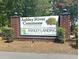 Community signage promoting Ashley River Commons as a Riverfront Community at 4630 Palm View Cir, North Charleston, SC 29418