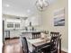 Kitchen nook with modern lighting, stainless appliances, and hardwood floors at 4630 Palm View Cir, North Charleston, SC 29418