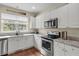 Modern kitchen with granite countertops, stainless steel appliances, and ample cabinet space at 4630 Palm View Cir, North Charleston, SC 29418