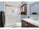 This updated bathroom features a vanity with a new faucet, toilet, and a glass-enclosed shower at 4752 Trailside Ct # B, North Charleston, SC 29418