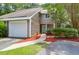 Inviting exterior showcasing the home's two-story layout, attached garage, and well-manicured front yard at 4752 Trailside Ct # B, North Charleston, SC 29418