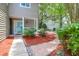 Neat landscaping with mulch, stone, and mature shrubbery leading up to the front door at 4752 Trailside Ct # B, North Charleston, SC 29418