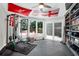 Bright home gym with workout equipment, large windows, and access to outdoor patio at 4752 Trailside Ct # B, North Charleston, SC 29418
