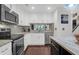 Updated kitchen featuring stainless steel appliances, sleek countertops, and bright white cabinetry at 4752 Trailside Ct # B, North Charleston, SC 29418