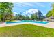 Beautiful community pool with ample seating and mature trees providing shade at 4752 Trailside Ct # B, North Charleston, SC 29418