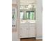 Charming wet bar with mirrored backsplash, white cabinetry, and elegant fixtures adjacent to the bright living space at 4856 Green Dolphin Way # Share 5, Kiawah Island, SC 29455