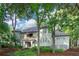 Inviting multi-story home with a serene setting surrounded by lush greenery and mature trees, and a charming facade at 4856 Green Dolphin Way # Share 5, Kiawah Island, SC 29455