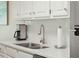 Close-up of kitchen featuring stainless steel appliances and white countertops with modern fixtures at 4856 Green Dolphin Way # Share 5, Kiawah Island, SC 29455