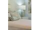 Cozy bedroom detail showcases seashell decorations, a lamp, and bedside table at 4856 Green Dolphin Way # Share 5, Kiawah Island, SC 29455