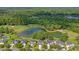 High aerial showcasing homes nestled within a lush, green landscape, adjacent to a golf course at 5256 Mulholland Dr, Summerville, SC 29485