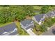 Beautiful two-story gray home, with a spacious driveway, and lush greenery near a pond and golf course at 5256 Mulholland Dr, Summerville, SC 29485