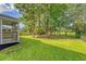 Backyard with an enclosed porch and view of a lake at 5256 Mulholland Dr, Summerville, SC 29485