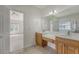 Bathroom with double vanity, tile flooring, and an opening into the Primary bedroom at 5256 Mulholland Dr, Summerville, SC 29485