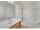 Well-lit bathroom features a bathtub and sink with a wood cabinet at 5256 Mulholland Dr, Summerville, SC 29485
