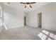Bedroom with neutral carpet and ceiling fan, plus two door openings to other spaces at 5256 Mulholland Dr, Summerville, SC 29485