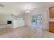 Bright breakfast nook with ceramic tile flooring leading to a screened-in porch and adjoins to the living room at 5256 Mulholland Dr, Summerville, SC 29485