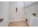 Bright laundry room features vinyl flooring, a utility sink, and wire shelving at 5256 Mulholland Dr, Summerville, SC 29485