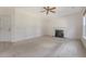 Neutral living room features carpet, fireplace, and natural lighting at 5256 Mulholland Dr, Summerville, SC 29485