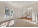 Bright and airy living room featuring plush carpeting, large windows, and an open floor plan at 5256 Mulholland Dr, Summerville, SC 29485