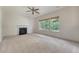 Bright living room with neutral carpet, fireplace, and natural lighting at 5256 Mulholland Dr, Summerville, SC 29485