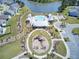 Aerial view of a community featuring a pool, playground, and a scenic lake at 528 Fern Tree Dr, Summerville, SC 29486