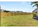 Spacious, grassy backyard with a wooden fence for privacy at 528 Fern Tree Dr, Summerville, SC 29486
