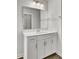 Modern bathroom featuring sleek white vanity with ample storage, illuminated mirror, and chrome hardware at 528 Fern Tree Dr, Summerville, SC 29486
