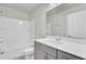 Clean bathroom with a combination shower and tub, large mirror, and modern vanity at 528 Fern Tree Dr, Summerville, SC 29486